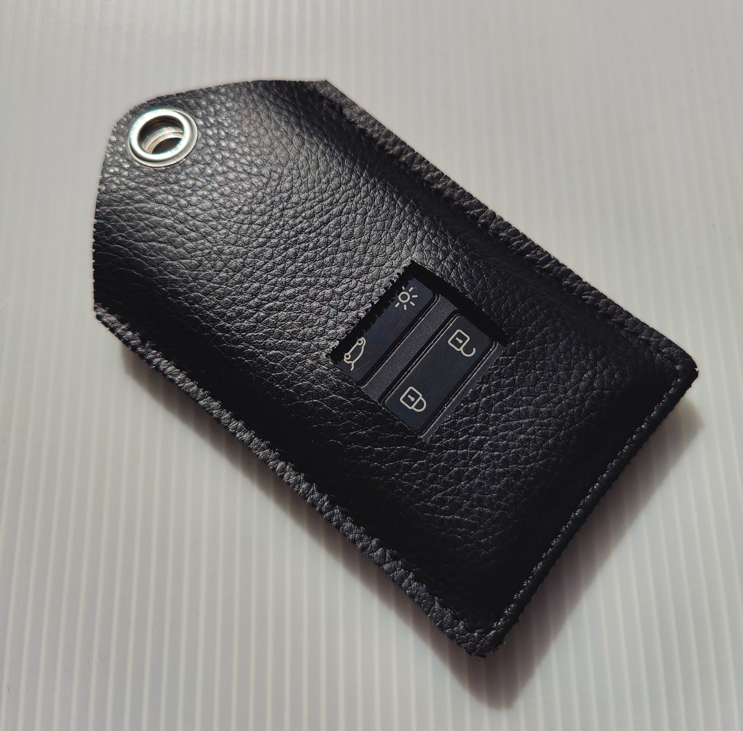 Card holder, key ring, vehicle